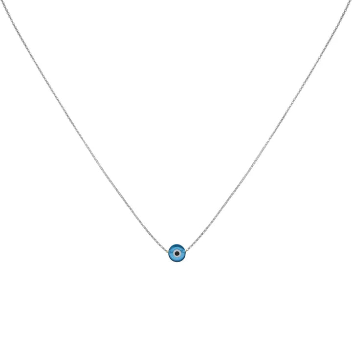 Model wearing minimalist gold evil eye necklace everyday style