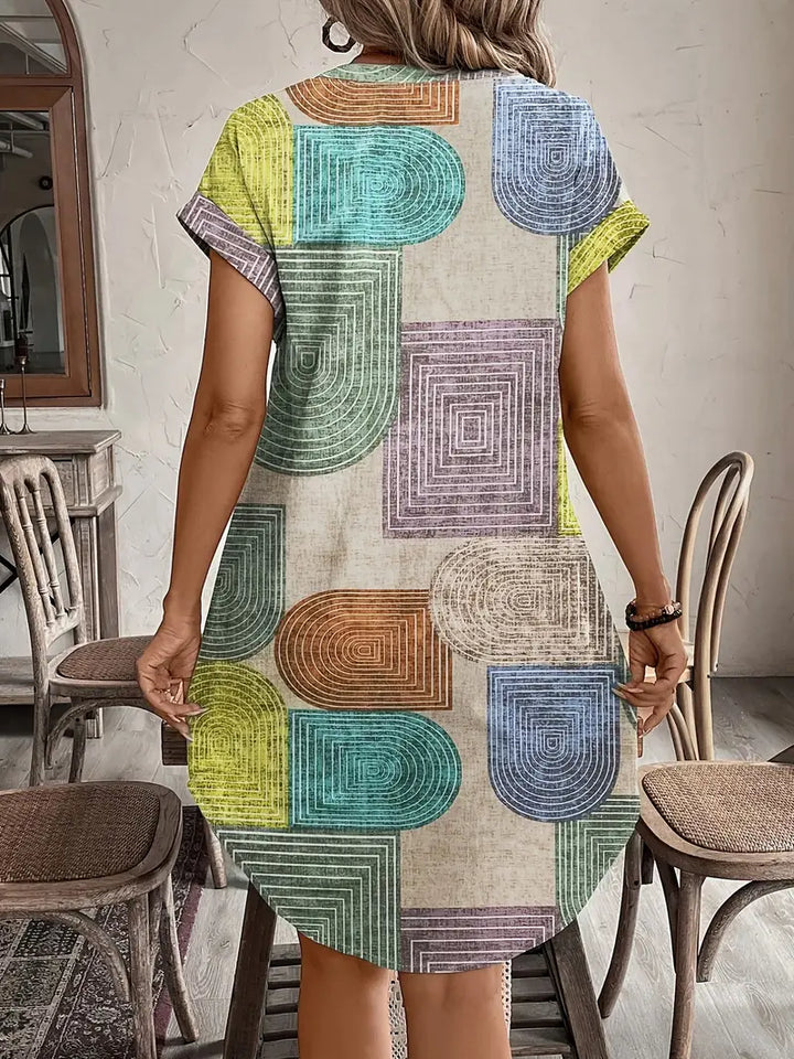 Women's geometric print midi dress back view showing relaxed fit
