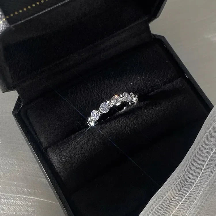 Elegant silver star ring displayed inside a luxury black jewelry box