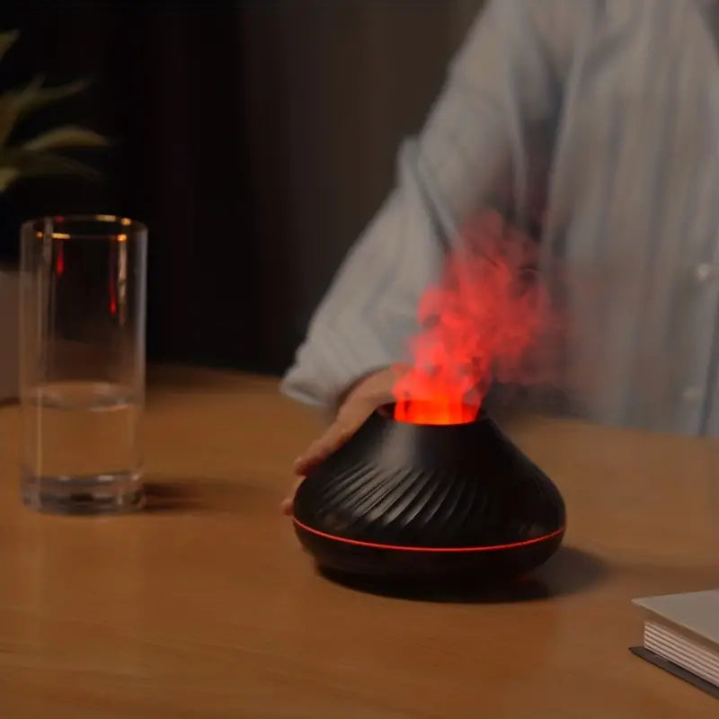 USB powered essential oil diffuser glowing with warm flame light for aromatherapy and room fragrance