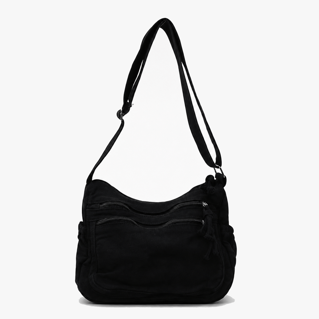 Side profile of olive green canvas handbag showing roomy design