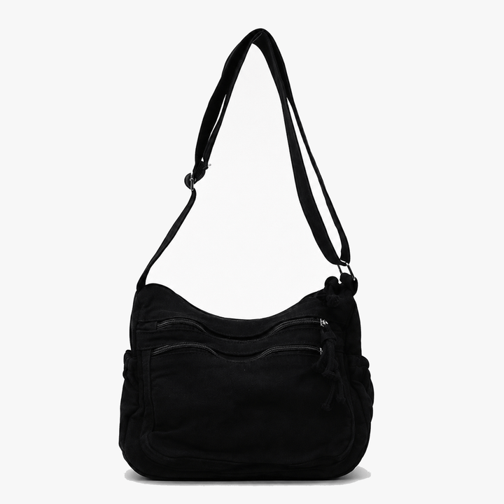 Side profile of olive green canvas handbag showing roomy design