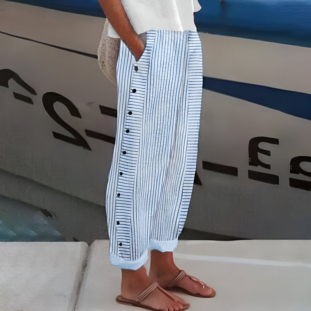 Woman wearing blue striped wide-leg cropped pants with side buttons