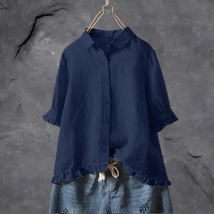 Navy blue women's collared blouse with short ruffle sleeves
