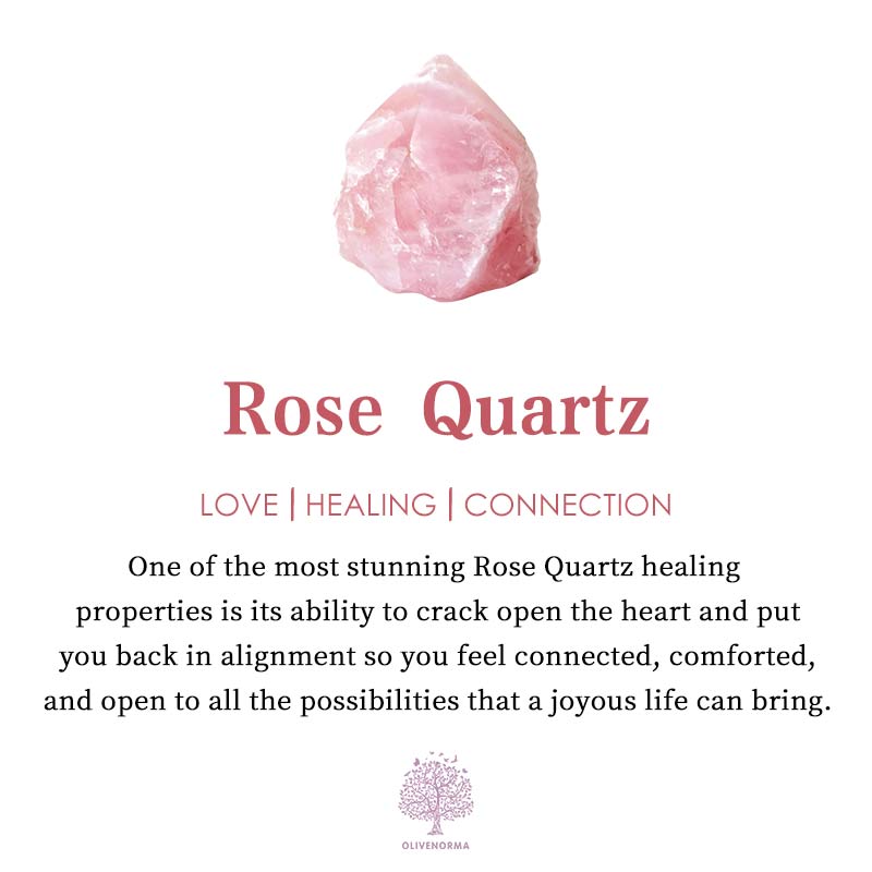 Rose quartz gemstone pendant necklace resting on a soft display surface