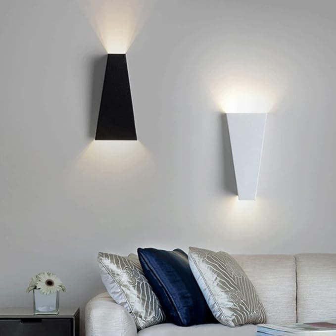 Modern LED wall lamp sconce glowing softly in a minimalist living room