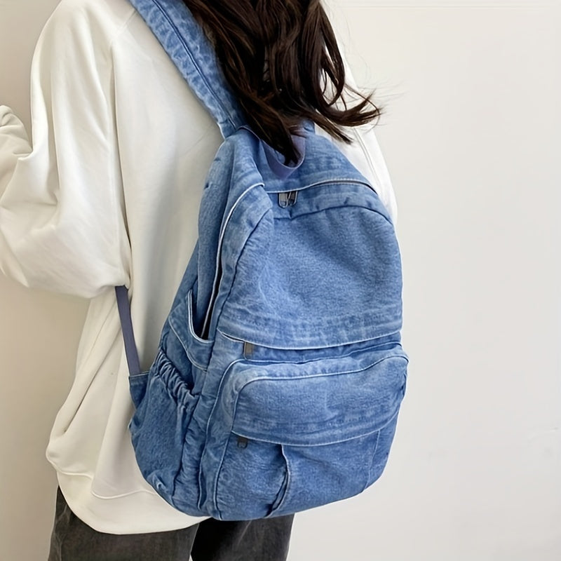 Unisex casual denim backpack close-up showing durable blue fabric and sturdy zippers