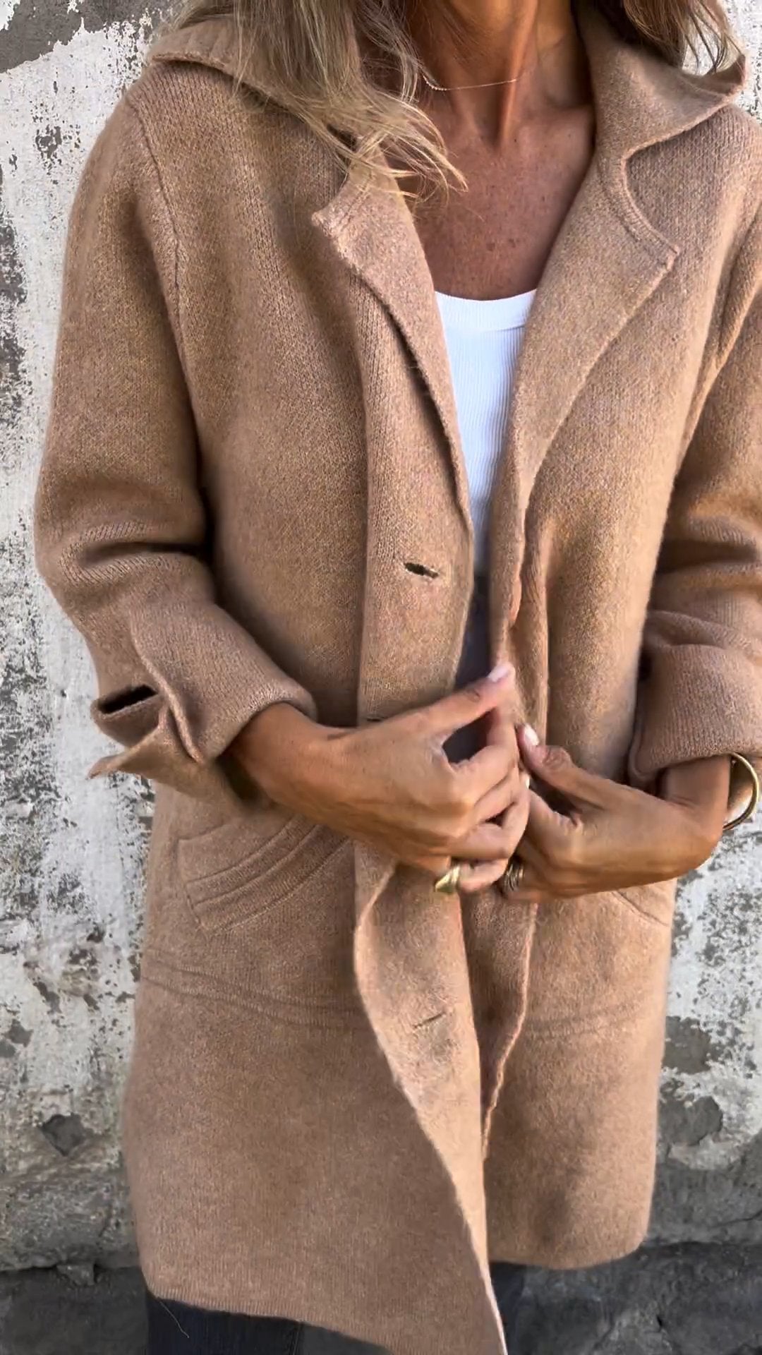 Model wearing the button down long knit coat for cold weather