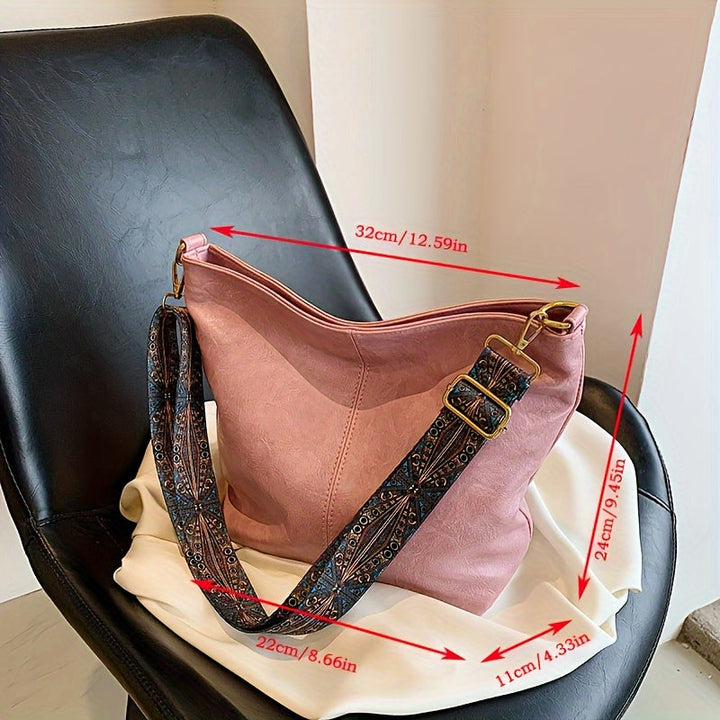Pattern alignment detail on the front flap of the geometric bag
