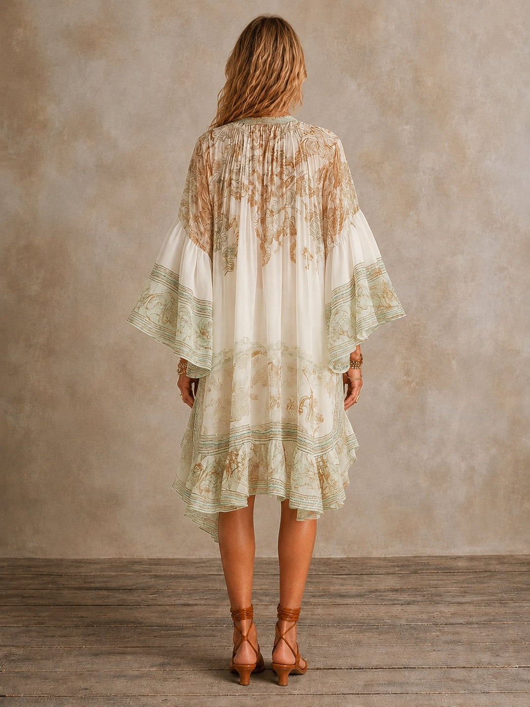 Close-up of the floral print fabric and long sleeves on the women's mini dress