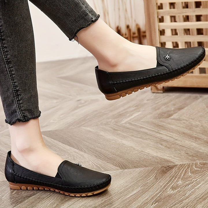 Close-up of the interior lining and comfort branding inside the soft casual footwear.