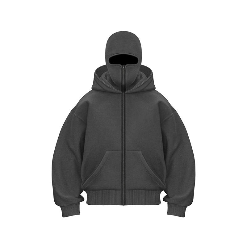 Close-up of the front zipper and mask hood detail on a black streetwear zip-up hoodie