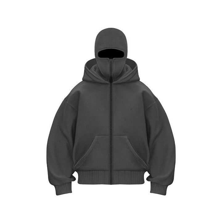 Close-up of the front zipper and mask hood detail on a black streetwear zip-up hoodie