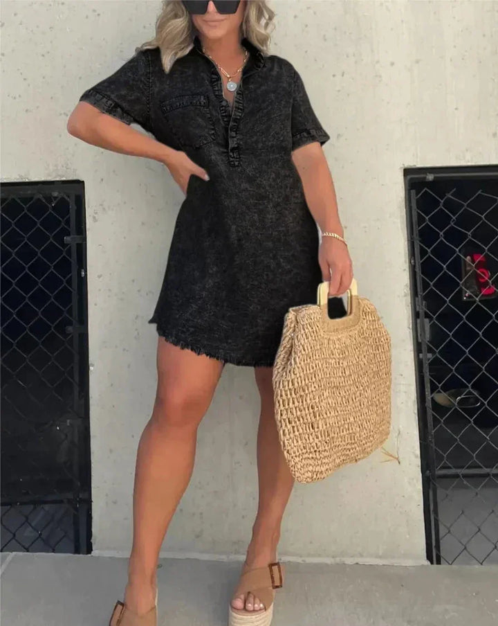 Full-length view of a versatile women's denim shirt dress styled for casual wear