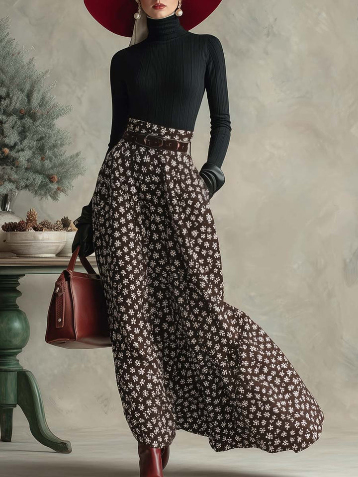 Woman wearing a black turtleneck top and snowflake print skirt set with a red hat