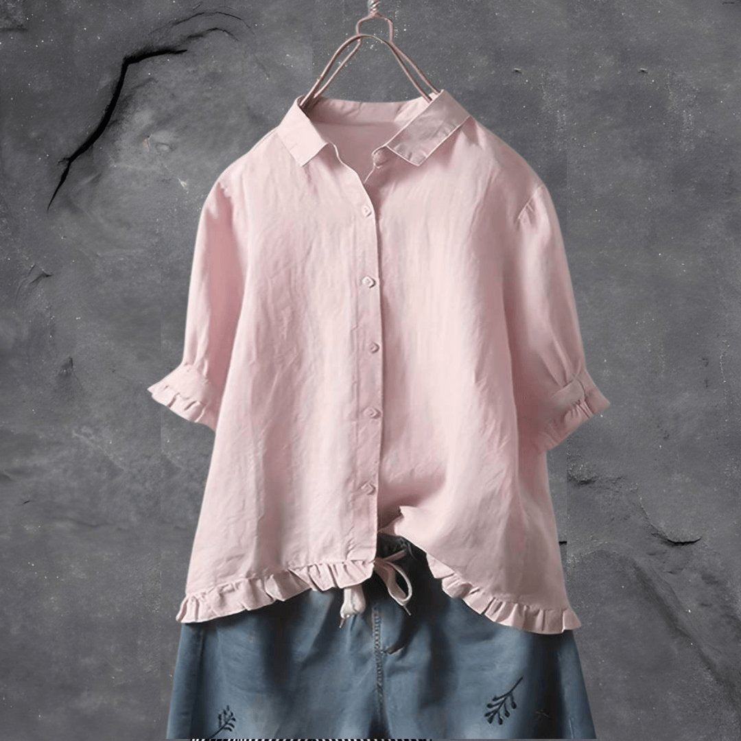 Full view of women's collared ruffle-hem blouse in relaxed fit