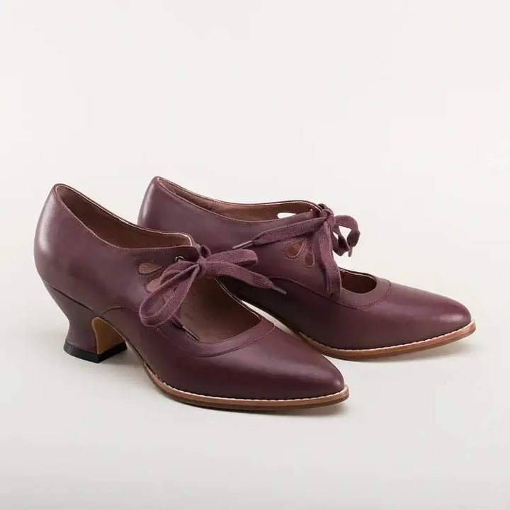 Detailed view of the supportive strap and buckle on comfortable women's low heel footwear.