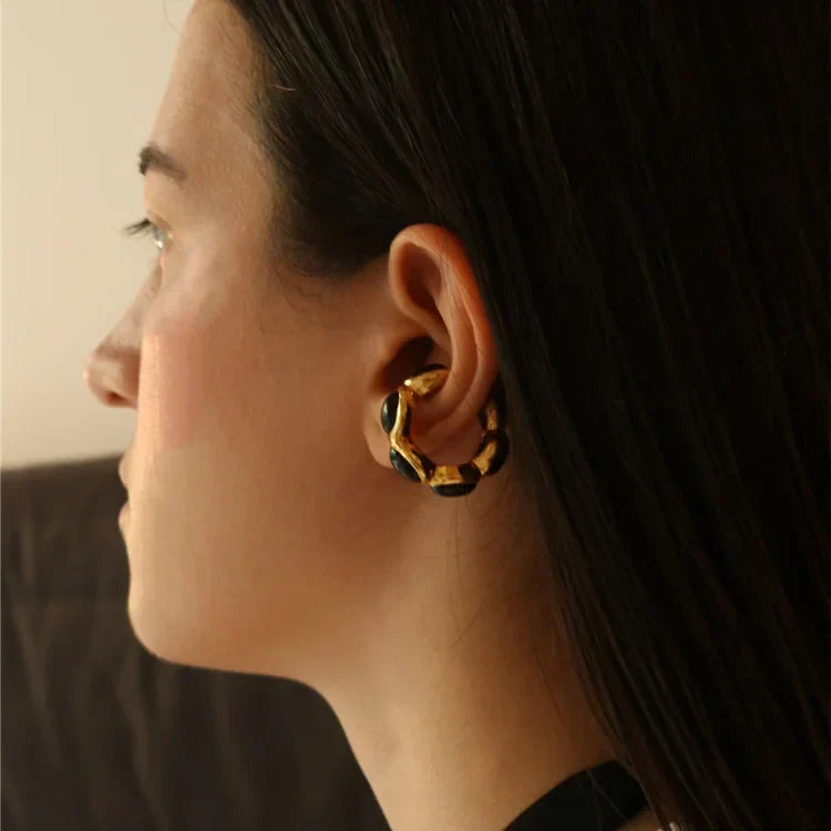 Matching gold-plated onyx ear cuff and ring set for women's elegant fashion.