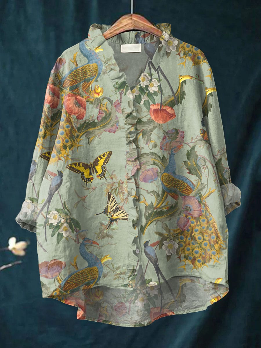 Women's Timeless Floral Print Blouse hanging on a wooden hanger against a dark backdrop.