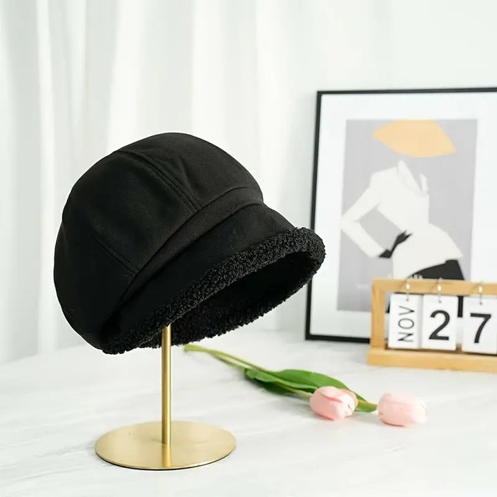 Assortment of winter bucket hats in beige, black, and brown