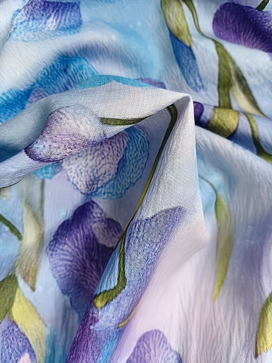 Purple floral button-up blouse with long sleeves, styled as a casual summer top for women.