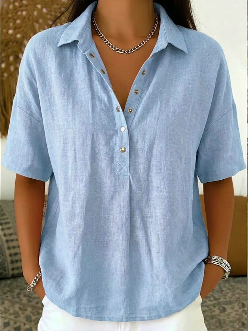 Close-up of lapel collar and button closure on women's summer top