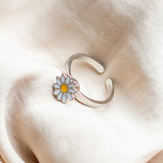 Silver band fidget ring paired with other stacking rings
