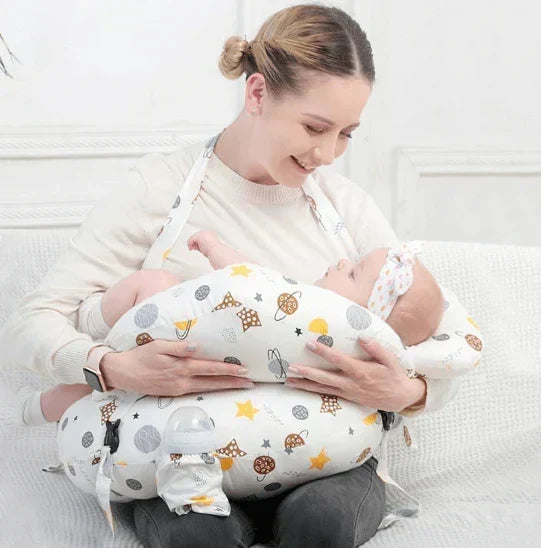Mother comfortably feeding baby using the ergonomic nursing pillow