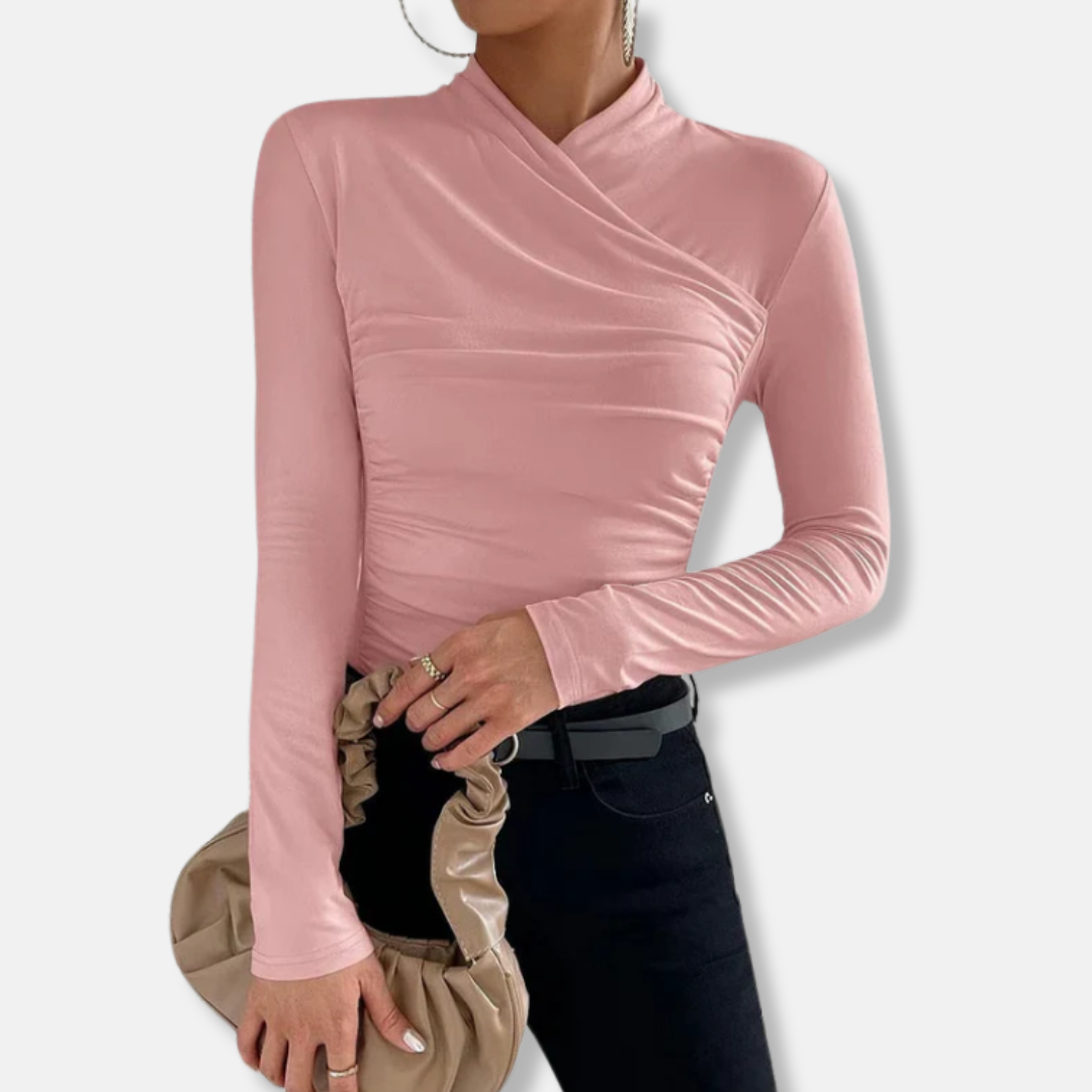 Close-up of ruched texture on fitted high-neck long sleeve chic blouse