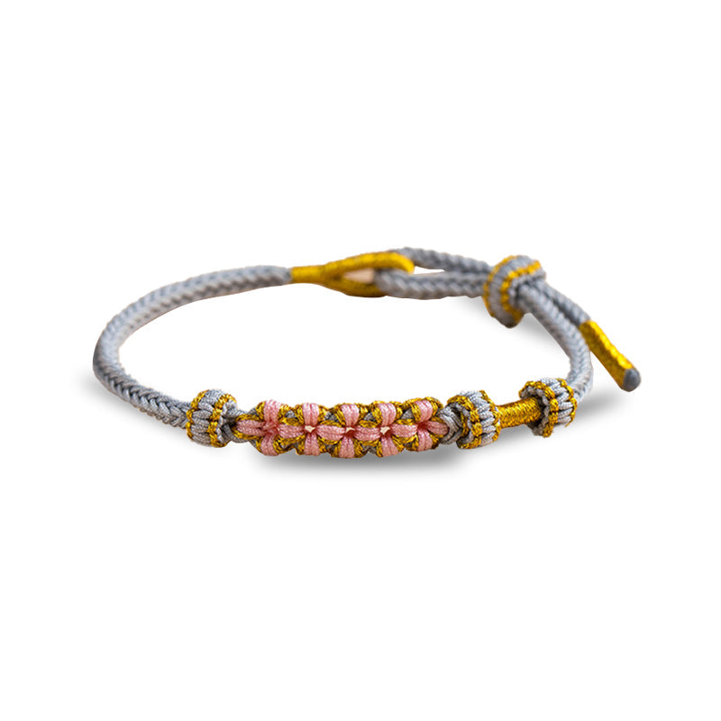 Minimalist women jewelry knot bracelet on display stand