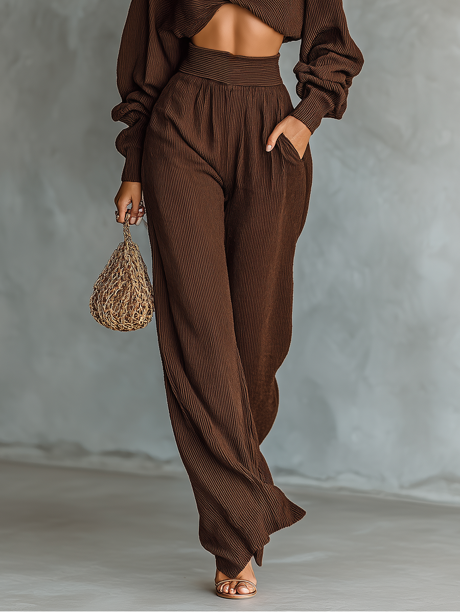 Back view of a casual chic women's knitted cropped top and wide-leg trousers lounge set
