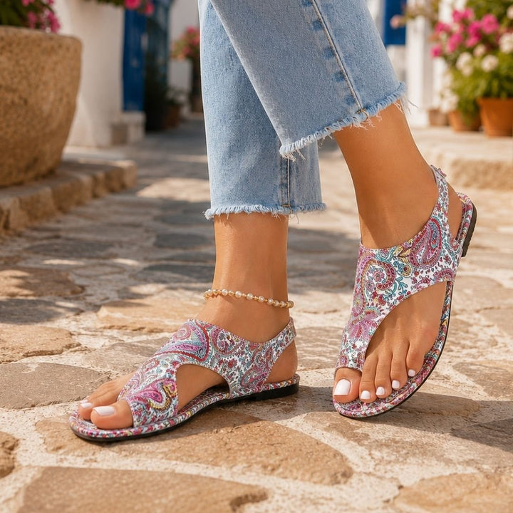 Side view of red summer sandals with ergonomic orthopaedic sole