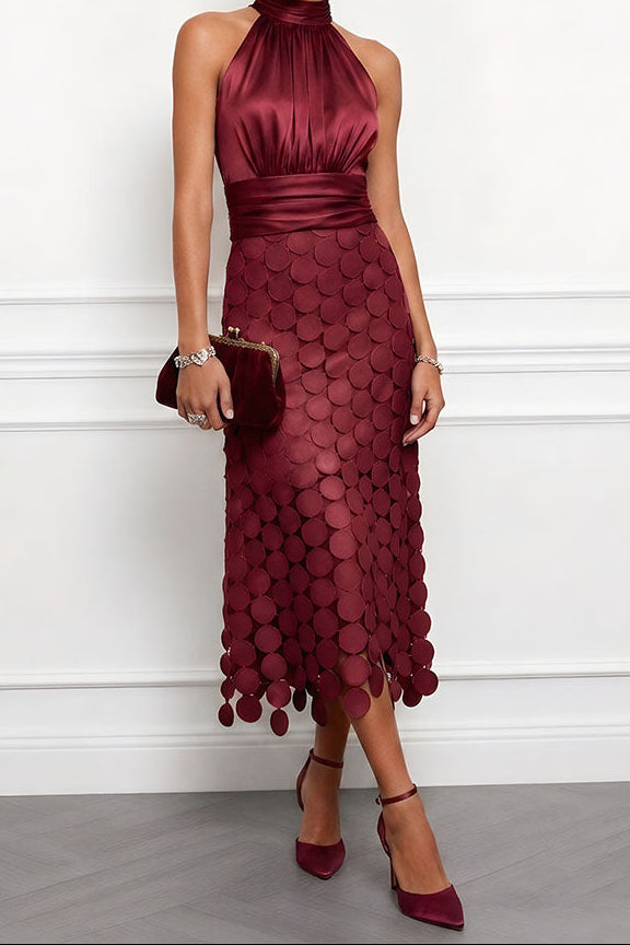 Close-up of the sophisticated halter neck design on the women's formal dress.