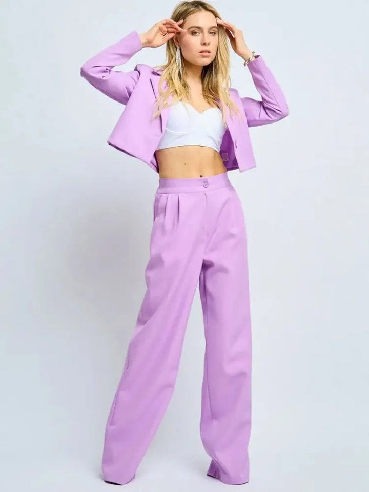 Model wearing a lilac elegant tailored jacket and matching high-waisted trousers