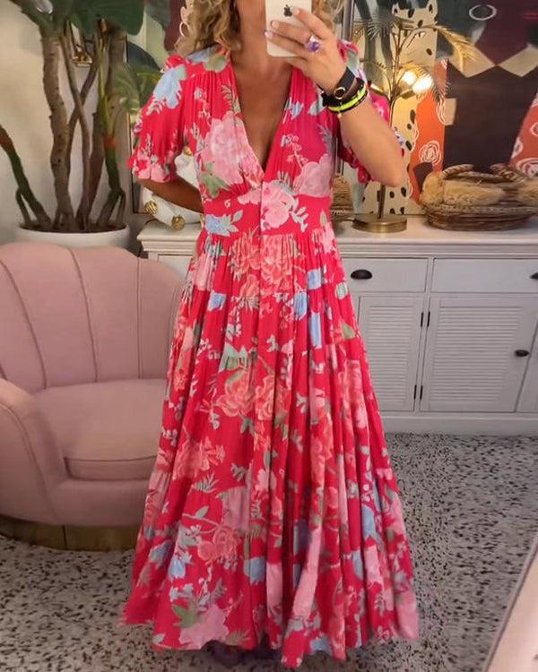Model posing in the elegant floral dress for a daytime summer event