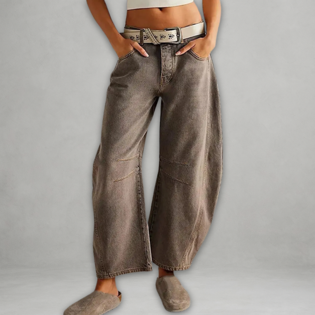 Back view of women's chic baggy jeans featuring high rise waist and oversized streetwear denim style