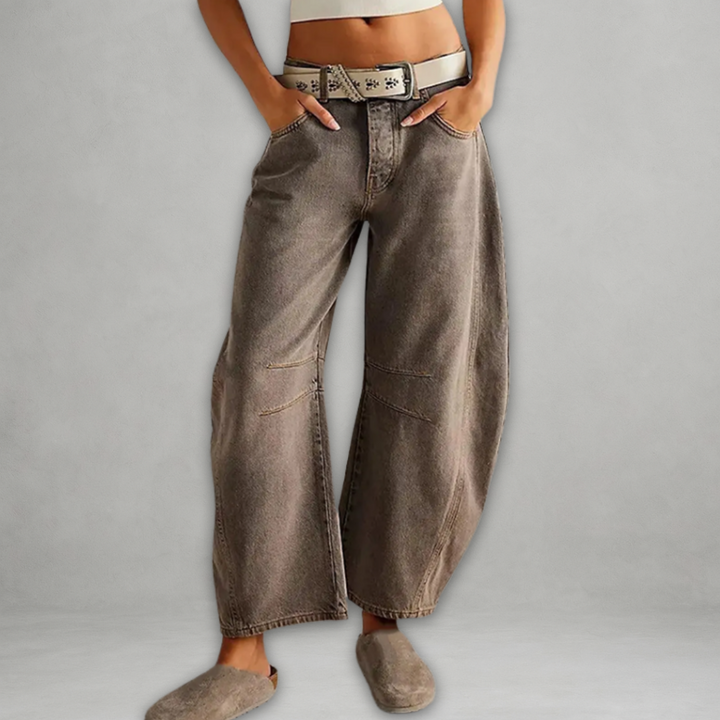 Back view of women's chic baggy jeans featuring high rise waist and oversized streetwear denim style