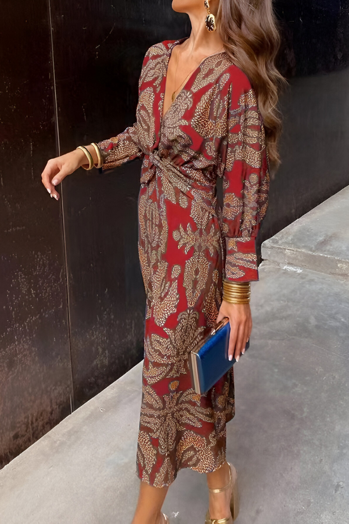 Woman wearing red floral midi dress with long sleeves