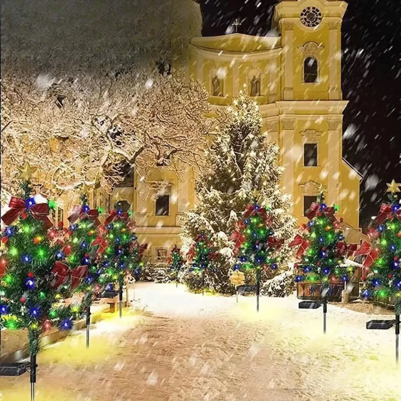 Solar LED Christmas tree garden lights set glowing outdoors