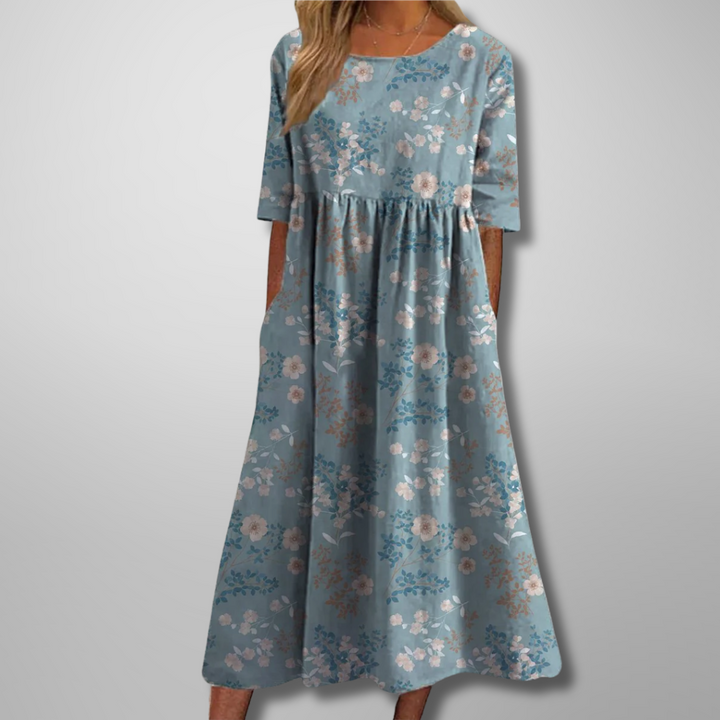 Casual loose-fit summer dress with vibrant floral pattern and midi length