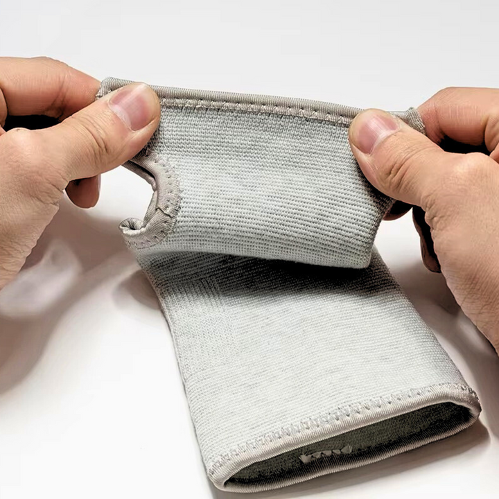 Close-up view of seamless grey wrist support sleeve fabric