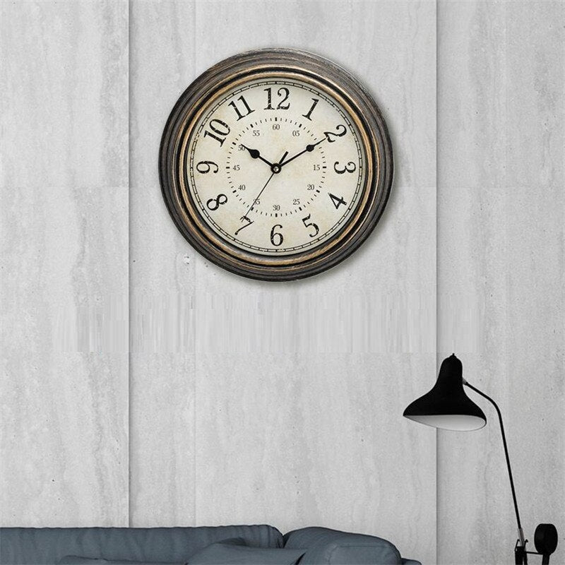 Vintage wall clock displayed on a textured wall above a sofa