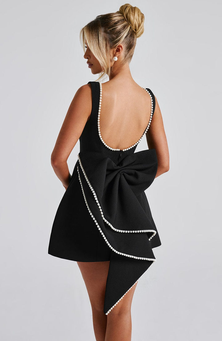 Back view of womens fashion pearl trim mini dress for summer events