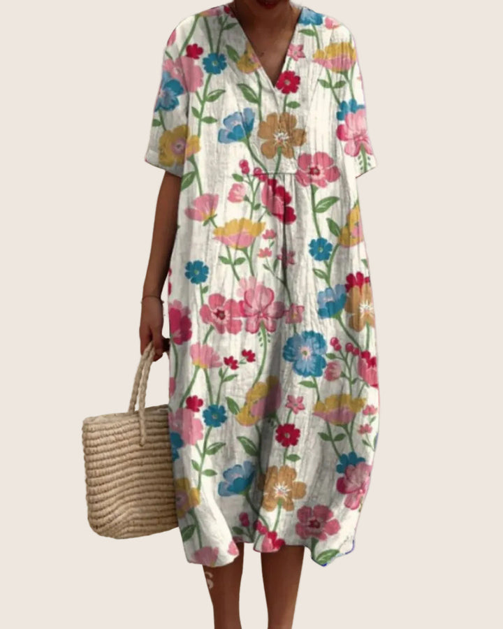 Front view of summer floral dress featuring short sleeves and V-neckline