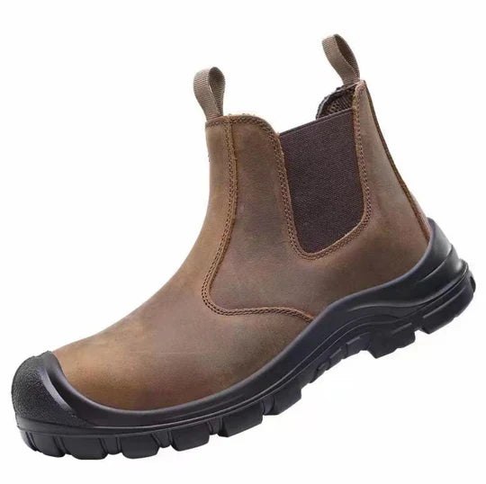 Close-up view of the protective steel toe cap on mens industrial work boots