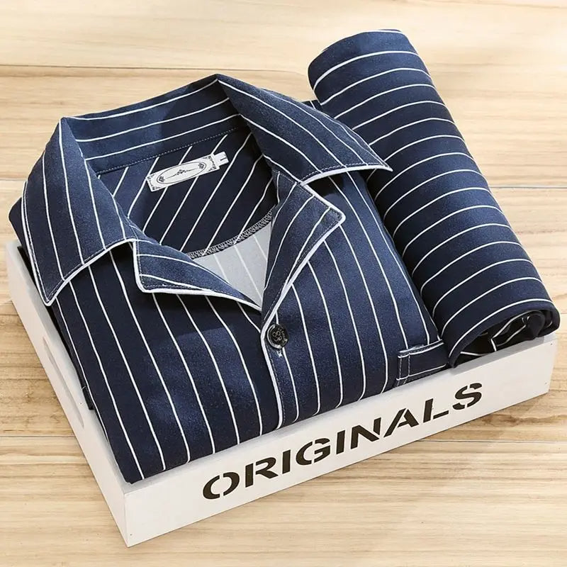 Side profile of man wearing classic button-up pyjamas for men
