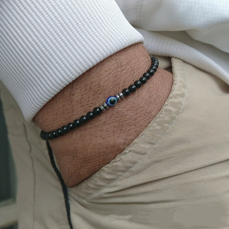 Casual mens stone bracelet featuring protective evil eye charm