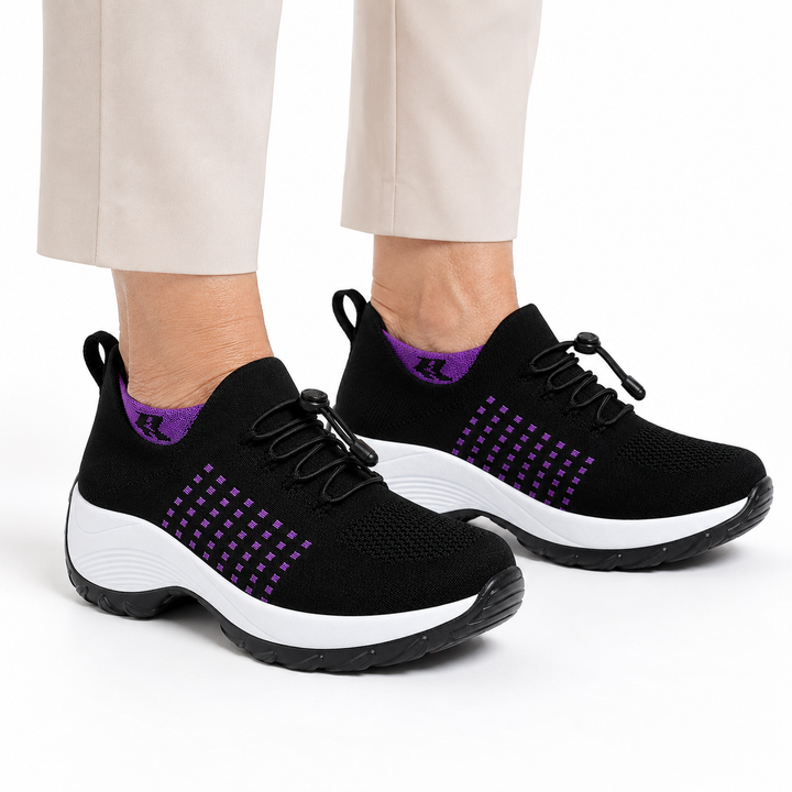 Lifestyle shot of woman walking comfortably in ergonomic trainers