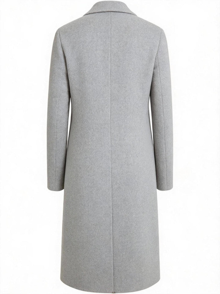 Close-up of the black trench coat collar and high-quality front buttoning.