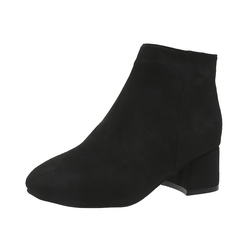 Close-up of block heel on women's casual ankle boots footwear